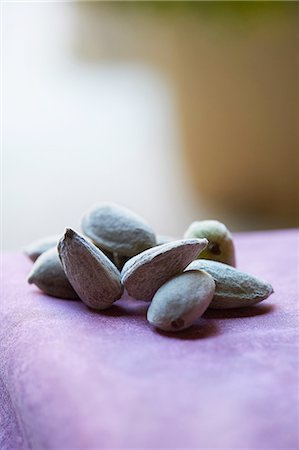 simsearch:649-08423033,k - Almonds in shell on purple colour table cloth Stock Photo - Premium Royalty-Free, Code: 649-08423040