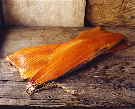 simsearch:649-08479771,k - Raw smoked salmon with skin on rustic wooden table Photographie de stock - Premium Libres de Droits, Code: 649-08423421