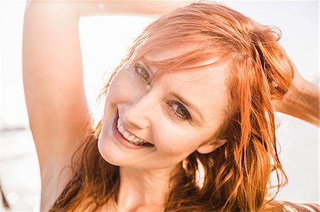 simsearch:649-08543989,k - Close up portrait of woman with long red hair on beach, Cape Town, South Africa Photographie de stock - Premium Libres de Droits, Code: 649-08544004