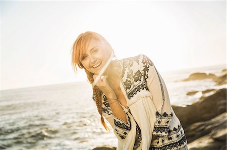 simsearch:649-08543989,k - Portrait of mid adult woman with red hair on sunlit beach, Cape Town, South Africa Photographie de stock - Premium Libres de Droits, Code: 649-08544033