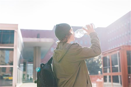 Young urban man drinking from bottle of water Stock Photo - Premium Royalty-Free, Code: 649-08548907