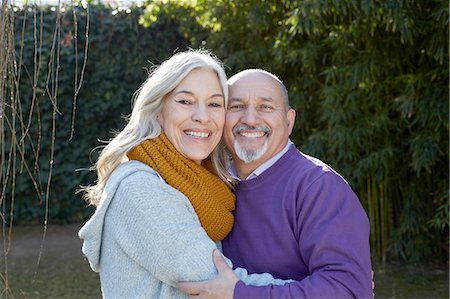 Mature couple hugging, looking at camera smiling Stock Photo - Premium Royalty-Free, Code: 649-08548954