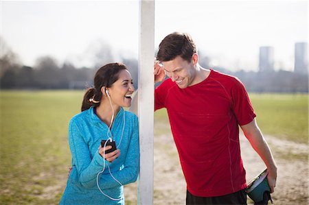 simsearch:649-08543409,k - Young woman and man warm up training on playing field Foto de stock - Sin royalties Premium, Código: 649-08543420