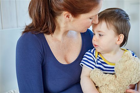 Mother and baby boy holding teddy bear Stock Photo - Premium Royalty-Free, Code: 649-08543514