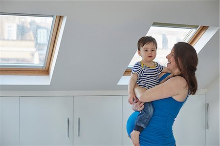 skylight - Side view of pregnant mother holding baby boy Stock Photo - Premium Royalty-Free, Code: 649-08543520