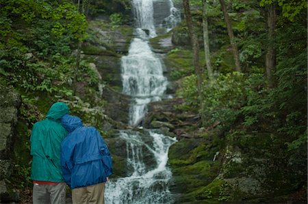 raincoat hood - Couple looking at a waterfall Stock Photo - Premium Royalty-Free, Code: 649-08564096