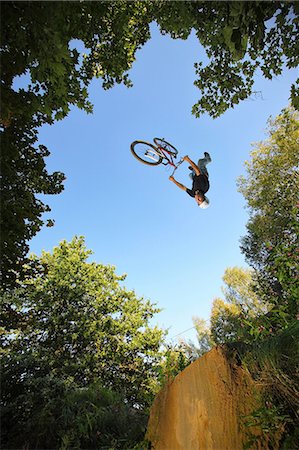 dirt track bike images - BMX rider upside down mid air Stock Photo - Premium Royalty-Free, Code: 649-08565217