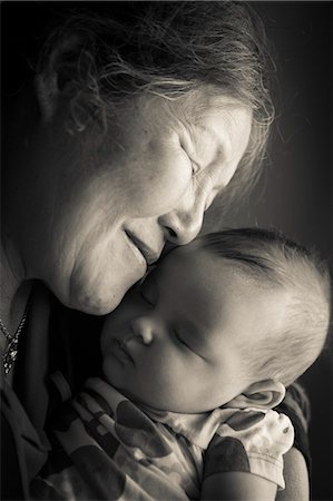 sleeping grandma - Portrait of grandmother holding baby granddaughter Stock Photo - Premium Royalty-Free, Code: 649-08565471