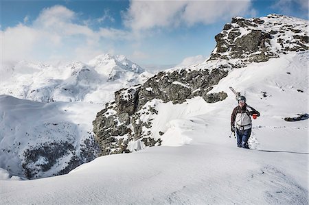 simsearch:649-07063053,k - Mid adult male skier walking along top of mountain with skis, Corvatsch, Switzerland Stock Photo - Premium Royalty-Free, Code: 649-08565714