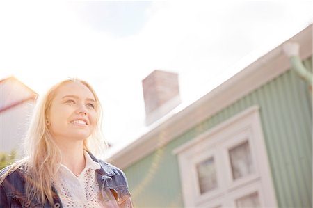 simsearch:649-08560718,k - Low angle view of house exterior and blonde haired teenage girl looking away smiling, Reykjavik, Iceland Photographie de stock - Premium Libres de Droits, Code: 649-08565896