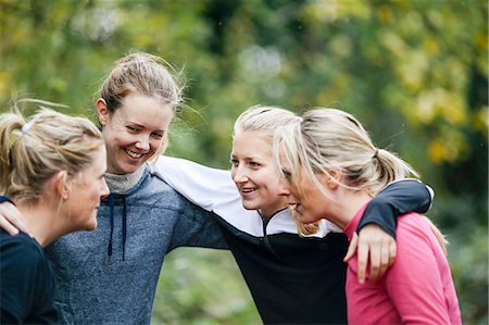 Teenage girl and women team planning in park Stock Photo - Premium Royalty-Free, Code: 649-08565996