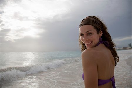 Smiling Woman on Beach Stock Photo - Premium Royalty-Free, Code: 649-08560174