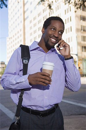 businessman on mobile phone in street Stock Photo - Premium Royalty-Free, Code: 649-08560578