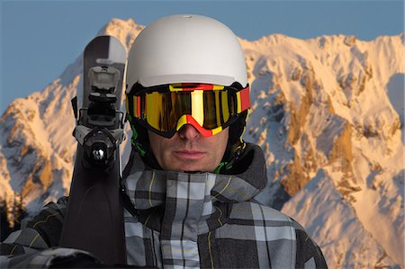simsearch:6122-07706662,k - Man carrying skis in snowy mountains Stock Photo - Premium Royalty-Free, Code: 649-08560735
