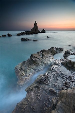 Fog rolling over rocky beach Stock Photo - Premium Royalty-Free, Code: 649-08560885