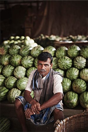 farmers market portrait - Vendor selling watermelons in market Stock Photo - Premium Royalty-Free, Code: 649-08560987