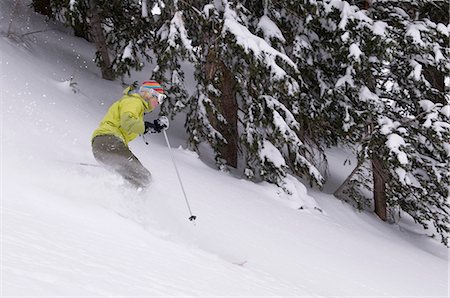 simsearch:649-06164798,k - Skier coasting down snowy slope Photographie de stock - Premium Libres de Droits, Code: 649-08561167