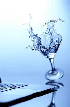 simsearch:649-03293611,k - Cocktail spilling on laptop Stock Photo - Premium Royalty-Free, Code: 649-08561202