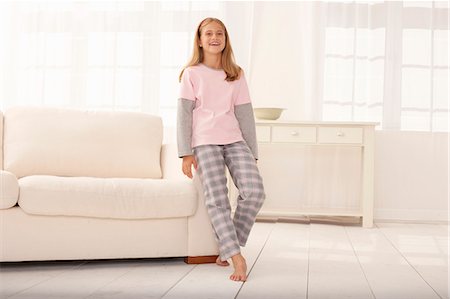 simsearch:649-03882060,k - Girl in pajamas leaning on couch Stock Photo - Premium Royalty-Free, Code: 649-08561272