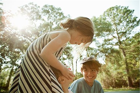 face, lens flare - Children playing together outdoors Stock Photo - Premium Royalty-Free, Code: 649-08561870