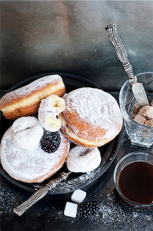 simsearch:614-06719721,k - Plate of donuts with coffee and sugar Stock Photo - Premium Royalty-Free, Code: 649-08562010