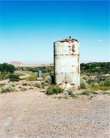 rusting tank - Water tank in rural setting, New Mexico, USA Stock Photo - Premium Royalty-Free, Code: 649-08562470