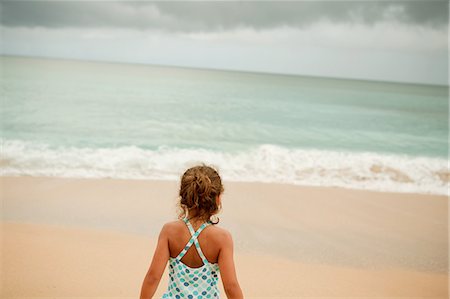 single caucasian girls in hawaii - Young girl standing on sandy beach Stock Photo - Premium Royalty-Free, Code: 649-08562835