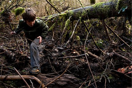 Boy hiking through forest Stock Photo - Premium Royalty-Free, Code: 649-08563313