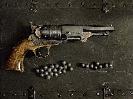 Handgun and bullets Stock Photo - Premium Royalty-Free, Code: 649-08563363