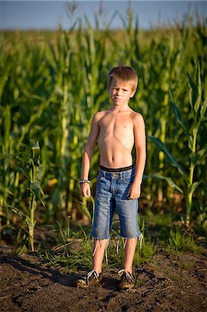 pouting kid - Boy in a corn field Stock Photo - Premium Royalty-Free, Code: 649-08563506