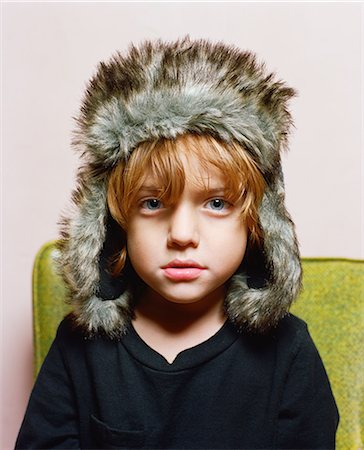 Boy wearing fur hat Stock Photo - Premium Royalty-Free, Code: 649-08563671