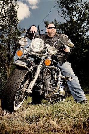 Portrait of a biker on motorcycle Stock Photo - Premium Royalty-Free, Code: 649-08563734