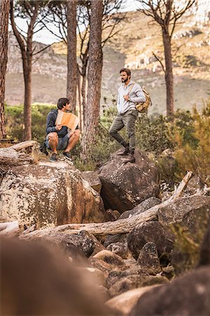 simsearch:649-08576583,k - Male hikers looking at map on forest rock formation, Deer Park, Cape Town, South Africa Stock Photo - Premium Royalty-Free, Code: 649-08576284
