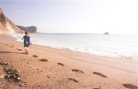 portuguese man-of-war - Girl enjoying beach, Man O'War Beach, Dorset Stock Photo - Premium Royalty-Free, Code: 649-08576406