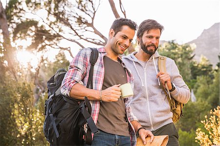 simsearch:6122-07692197,k - Two male hikers preparing for hike in forest, Deer Park, Cape Town, South Africa Foto de stock - Sin royalties Premium, Código: 649-08576556