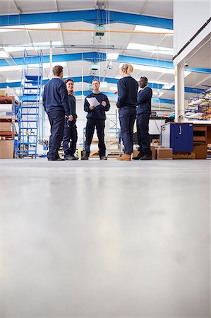 simsearch:649-08576616,k - Surface level view of manager explaining to team in manufacturing factory Stock Photo - Premium Royalty-Free, Code: 649-08576613