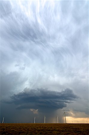 A beautiful updraft seen in a storm behind a field of wind turbines in eastern Colorado, USA Stock Photo - Premium Royalty-Free, Code: 649-08576662