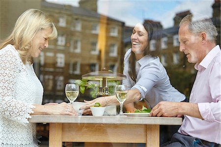 Waitress serving lunch to mature dating couple at restaurant table, London, UK Stock Photo - Premium Royalty-Free, Code: 649-08577204