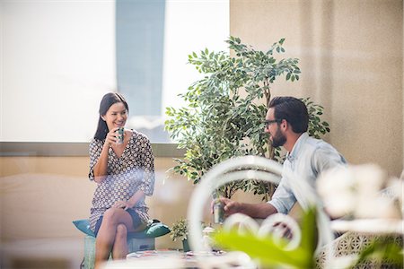 simsearch:649-08577651,k - Couple talking and drinking mint tea on hotel room  balcony, Dubai, United Arab Emirates Stock Photo - Premium Royalty-Free, Code: 649-08577534