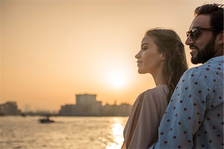 simsearch:649-08577612,k - Romantic couple watching sunset at Dubai marina, United Arab Emirates Photographie de stock - Premium Libres de Droits, Code: 649-08577649