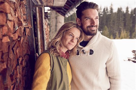 rustic cabin exterior - Couple standing outside log cabin in winter, Elmau, Bavaria, Germany Stock Photo - Premium Royalty-Free, Code: 649-08577709