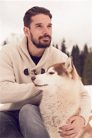 simsearch:649-09251794,k - Young man petting husky in snow, Elmau, Bavaria, Germany Photographie de stock - Premium Libres de Droits, Code: 649-08577715