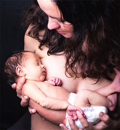 son sleeping - Mid adult mother cradling sleeping baby boy Stock Photo - Premium Royalty-Free, Code: 649-08577800