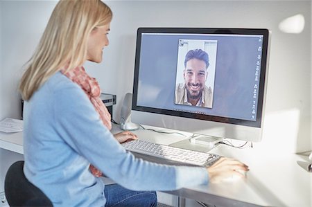 separato - Woman making desktop video call to boyfriend Fotografie stock - Premium Royalty-Free, Codice: 649-08578104