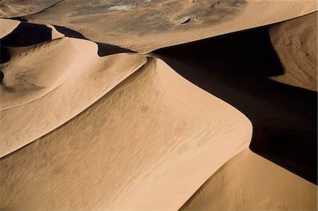 simsearch:649-08969763,k - Sand dunes in desert landscape Fotografie stock - Premium Royalty-Free, Codice: 649-08632413