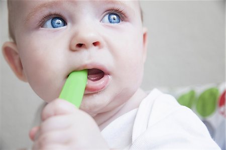 Close up of baby boy chewing teething toy Stock Photo - Premium Royalty-Free, Code: 649-08660659