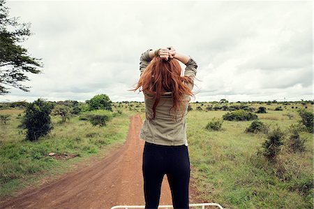 Woman enjoying ride on top of vehicle in wildlife park, Nairobi, Kenya Stockbilder - Premium RF Lizenzfrei, Bildnummer: 649-08660890