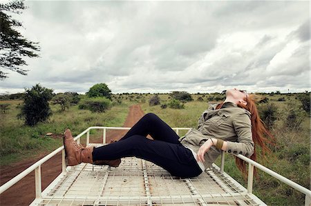 Woman enjoying ride on top of vehicle in wildlife park, Nairobi, Kenya Fotografie stock - Premium Royalty-Free, Codice: 649-08660891