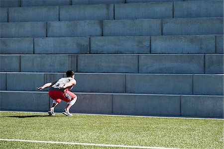 simsearch:649-08237639,k - Young man training, preparing to jump up playing field stairway Stock Photo - Premium Royalty-Free, Code: 649-08660952