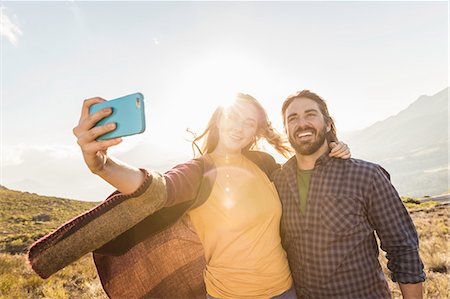 selfie travel - Couple taking selfie on sunny day, Franschhoek, South Africa Stock Photo - Premium Royalty-Free, Code: 649-08661061